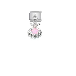 Macro detail of a silver stainless steel seashell charm with a pink star inlay ornament