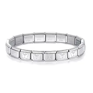 Close-up of silver stainless steel modular stretch bracelet with butterfly engraving