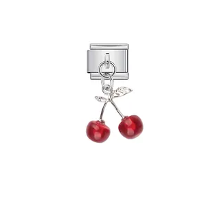 Detail showing a red cherry modular charm for DIY Italian style bracelets.