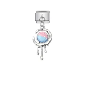 Close-up of a stainless steel modular charm with a pink and blue gradient bead.
