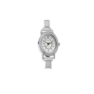 Macro view of silver vintage oval watch dial with NAIDU logo and rhinestone encrusted bezel