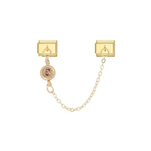 Detailed view of gold modular charm links connected by a fine chain with a champagne star stone