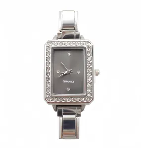 Detailed view of square quartz watch with silver steel band and crystal bezel