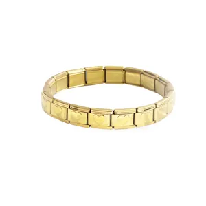 Detailed view of gold stainless steel Italian charm bracelet with heart patterns