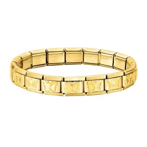 Detail of modular gold stainless steel Italian charm bracelet with butterfly motif