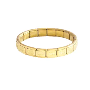 Close-up of gold-plated stainless steel Italian link bracelet with evil eye engraving