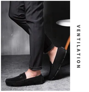 Close-up detail of black suede men's loafers designed for comfortable driving style