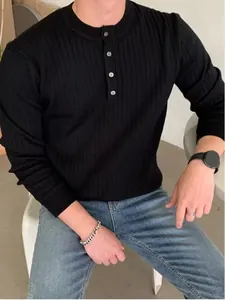 Classic men's black long sleeve ribbed henley sweater featuring button neckline detail