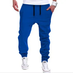 Stylish men's electric blue fashion drop-crotch joggers with black drawstring waist