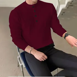 Detail view of men's burgundy ribbed knit Henley sweater with buttoned mock neck