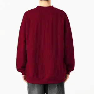 Detailed back view of men's burgundy vertical striped textured knit sweater with ribbed cuffs