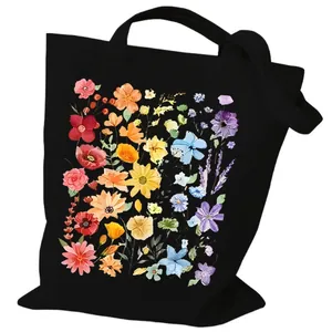 Black canvas tote bag featuring a vibrant rainbow floral print for daily shopping