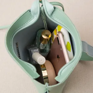 Interior view of mint green minimalist bucket bag showing large capacity for essentials