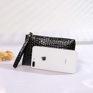 Elegant black crocodile pattern clutch bag and wristlet for women, perfect for mobile phone