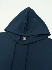 Detail view of the drawstring hood and neckline on a navy blue sleeveless gym vest