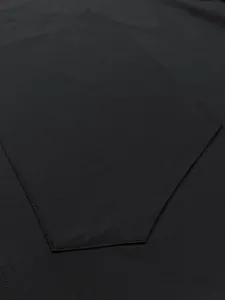 Close-up detail of pocket and stitching on a men's black quick-dry sport tank top.