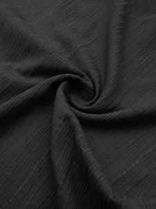 Detailed macro view of black wavy pleated fabric for men's summer sleeveless vest shirt