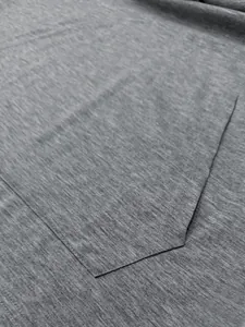 Close-up of high-quality gray quick-dry fabric and stitching on a sports tank top