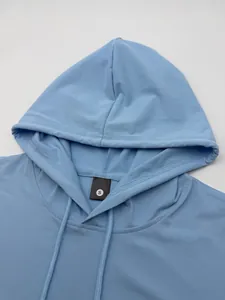 Close-up detail of light blue men's quick-dry hooded gym vest showing size S label