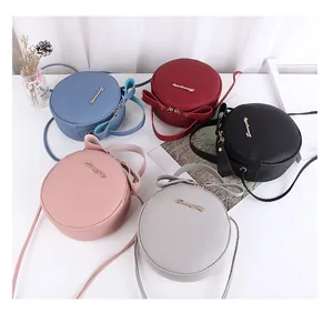 Collection of stylish small round crossbody bags in five colors featuring cute bow accents