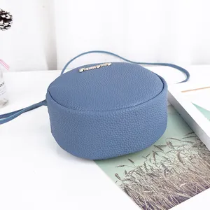 Trendy Korean style blue round crossbody bag for women with pebbled leather texture