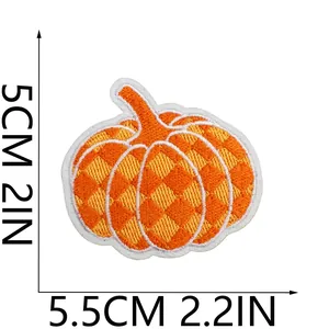 Close-up view of a checkered pumpkin embroidered patch showing 5.5cm by 5cm dimensions