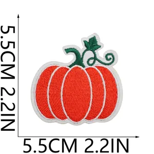 Detail macro view of pumpkin embroidery patch showing 5.5cm x 5.5cm size dimensions