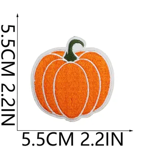 Detail of embroidered pumpkin patch showing 5.5cm size markings for DIY clothing