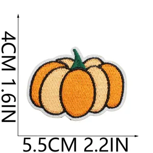 Detailed close-up of a decorative orange pumpkin embroidered iron-on patch with dimensions