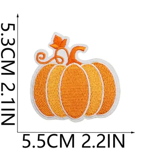 Embroidered pumpkin patch dimension details showing 5.5cm width and 5.3cm height.