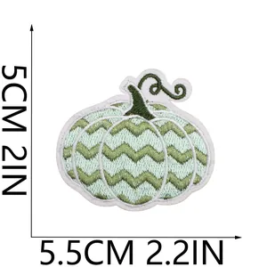 Detail of pumpkin embroidered patch with 5.5cm x 5cm size dimensions shown.