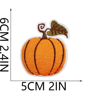 Detailed view of the 6x5cm embroidered pumpkin patch for iron-on crafts.