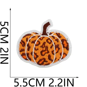 Close-up view of a leopard print pumpkin embroidered patch with clear size dimensions