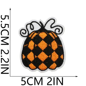 Embroidered pumpkin patch with checkerboard pattern showing dimensions 5x5.5 cm