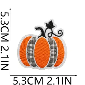 Detail view of an embroidered pumpkin patch showing precise 5.3cm x 5.3cm measurements