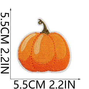 Detailed view of an orange embroidered pumpkin patch showing size 5.5cm or 2.2in measurements.