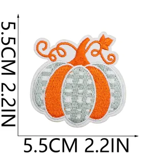 Close-up of artistic pumpkin embroidery patch with dimensions 5.5cm or 2.2in for DIY crafts.
