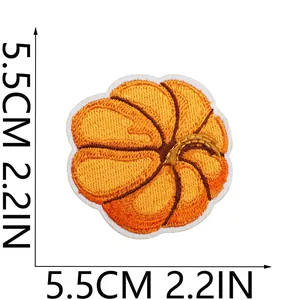 Detailed close-up view of a vibrant pumpkin embroidery patch with 5.5cm measurements