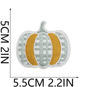 Close-up of pumpkin embroidered patch showing dimensions of 5.5cm by 5cm