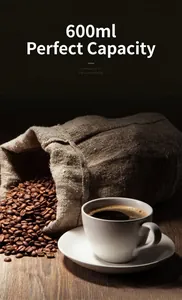 Close-up of freshly brewed coffee and roasted beans highlighting 600ml capacity.