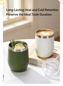 Lifestyle view of green and white vacuum insulated egg-shell cups on a bright table
