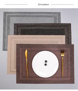 Detailed view of four woven PVC placemats in grey, black, beige, and brown color options.