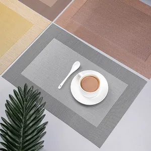 Set di tovagliette americane moderne in PVC intrecciato resistenti al calore per tavola