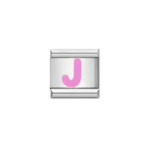 Macro detail of a high-quality stainless steel Italian charm link featuring a pink letter J