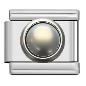 Close-up of a stainless steel modular Italian charm link with a center pearl detail.