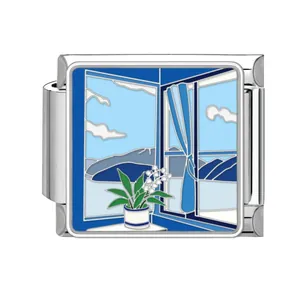 Detailed view of a stainless steel Italian charm link featuring a blue window enamel design.