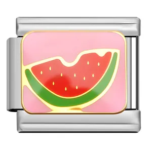 Close-up of stainless steel Italian charm link with pink enamel watermelon slice design.