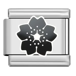 Close-up of Italian charm link featuring a black and white sakura cherry blossom design