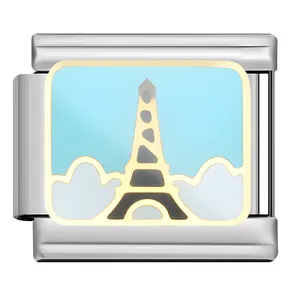Detail view of Italian charm link featuring an Eiffel Tower enamel landscape design