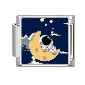 Close-up detail of an enamel astronaut on a crescent moon Italian charm link